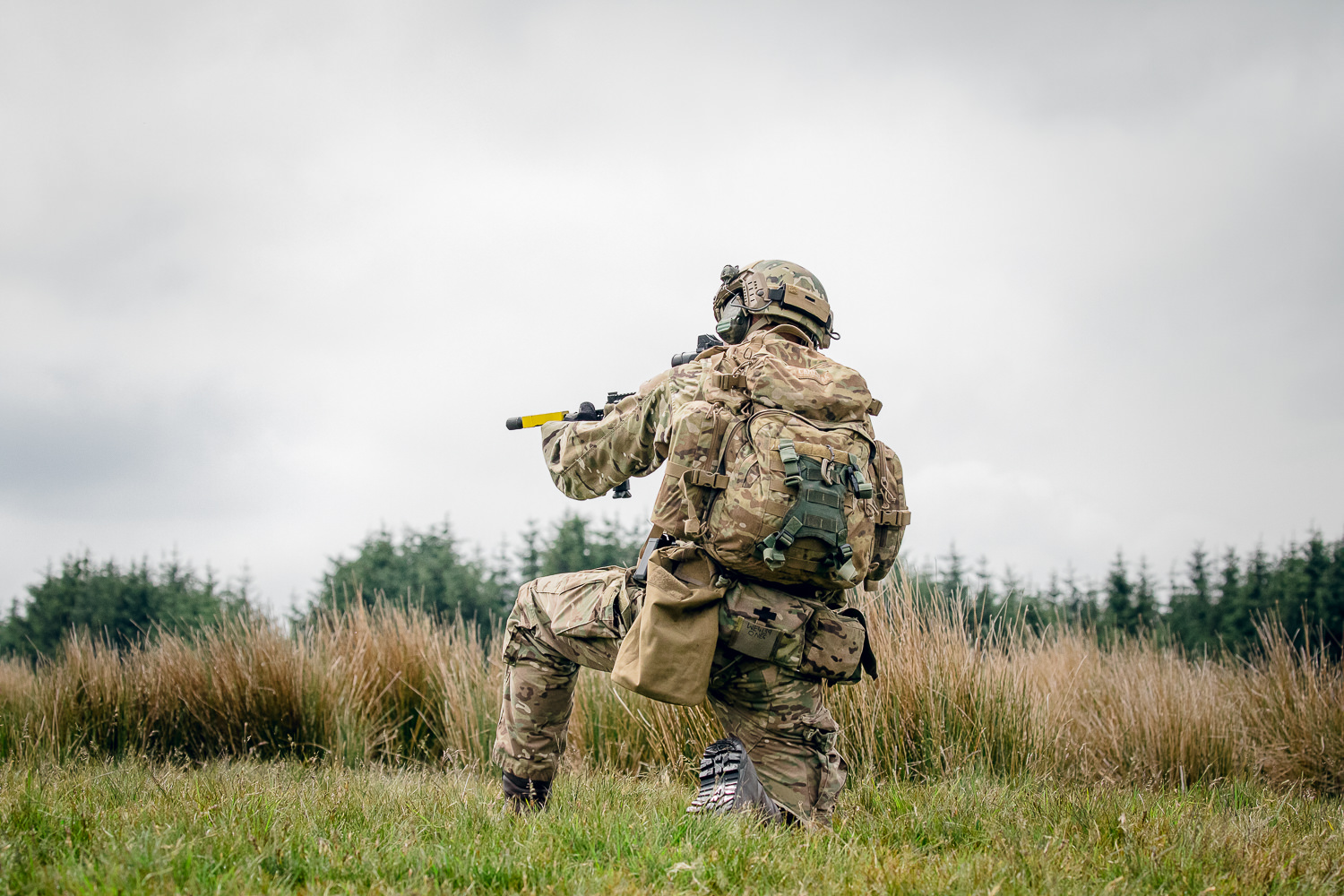 Crouching UK Army soldier on patrol wearing virtus MTP