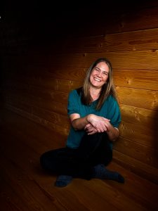 Portrait of a smiling woman in her yoga studio shot remotely using a Google Pixel 3 smartphone.