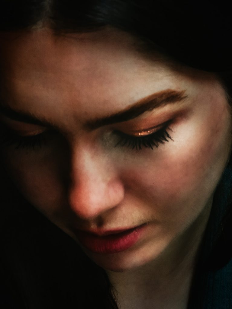 Remote portrait of a girl looking down taken by Pixellit Commercial Photography